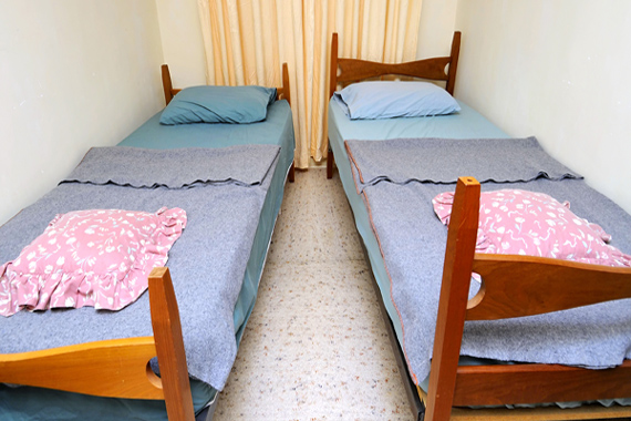 Twin beds in simple motel room